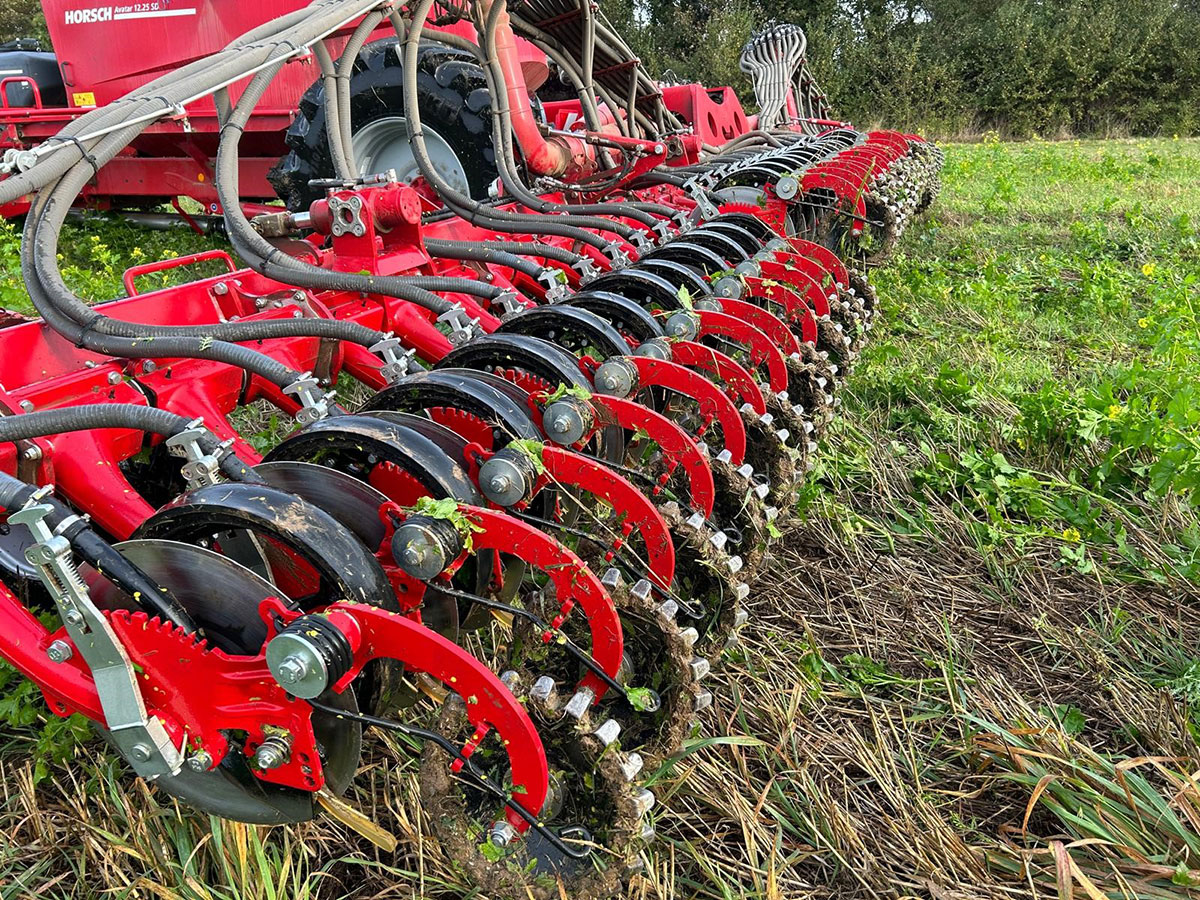 Image of combine and flowers by Quex Park Farming Services